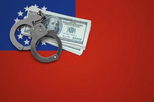 Myanmar flag  with handcuffs and a bundle of dollars. The concept of breaking the law and thieves crimes photo