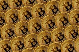 Pattern of many golden bitcoins. Cryptocurrency mining concept photo