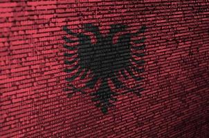 Albania flag  is depicted on the screen with the program code. The concept of modern technology and site development photo
