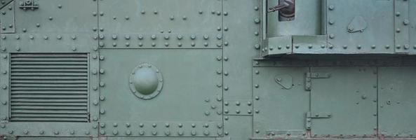 Abstract green industrial metal textured background with rivets and bolts photo