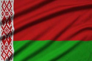 Belarus flag  is depicted on a sports cloth fabric with many folds. Sport team banner photo