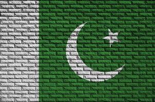 Pakistan flag is painted onto an old brick wall photo