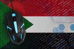 Sudan flag  and computer mouse. Digital threat, illegal actions on the Internet photo