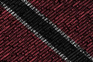 Trinidad and Tobago flag  is depicted on the screen with the program code. The concept of modern technology and site development photo