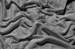 fondo de textura de tela de ropa deportiva, vista superior de la superficie textil de tela gris foto
