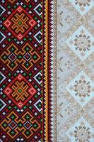 Traditional Ukrainian folk art knitted embroidery pattern on textile fabric photo