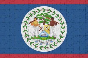 Belize flag  is depicted on a folded puzzle photo