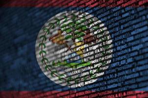 Belize flag  is depicted on the screen with the program code. The concept of modern technology and site development photo