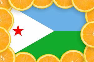 Djibouti flag  in fresh citrus fruit slices frame photo