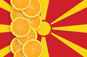 Macedonia flag and citrus fruit slices vertical row photo