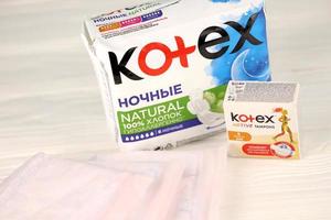 KHARKIV, UKRAINE - DECEMBER 16, 2021 Kotex production with logo. Kotex is a brand of feminine hygiene products, includes maxi, thin and ultra thin pads. photo