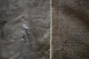 The texture of a very old brown sack cloth. Retro texture with canvas material. Background image with copy space photo