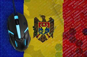 Moldova flag  and computer mouse. Digital threat, illegal actions on the Internet photo