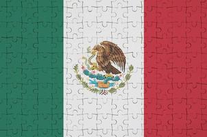 Mexico flag  is depicted on a folded puzzle photo