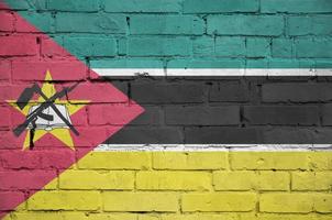 Mozambique flag is painted onto an old brick wall photo