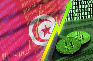 Tunisia flag and cryptocurrency growing trend with two bitcoins on dollar bills and binary code display photo