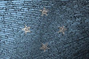 Micronesia flag  is depicted on the screen with the program code. The concept of modern technology and site development photo
