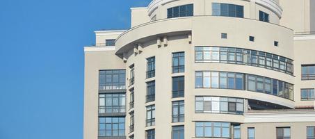 Multi-story office building with blue sky photo