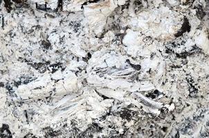 Pile of ashes after the fire went out grunge background texture photo