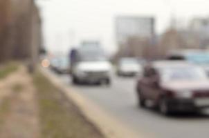 Blurred landscape with a city road during traffic photo