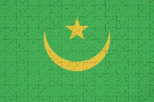 Mauritania flag  is depicted on a folded puzzle photo