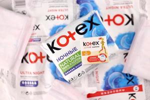 KHARKIV, UKRAINE - DECEMBER 16, 2021 Kotex production with logo. Kotex is a brand of feminine hygiene products, includes maxi, thin and ultra thin pads. photo