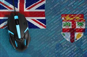 Fiji flag  and computer mouse. Digital threat, illegal actions on the Internet photo