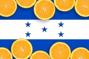 Honduras flag  in citrus fruit slices horizontal frame photo