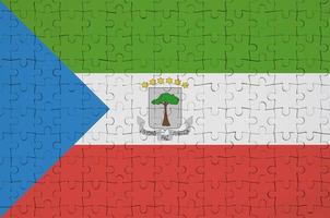 Equatorial Guinea flag  is depicted on a folded puzzle photo