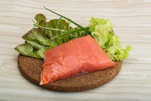 Salmon fillet on wood photo