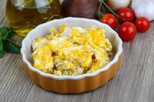 Scrambled eggs on wood photo