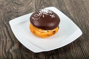 Bouchee cake on the plate and wooden background photo