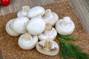 Champignons on wood photo