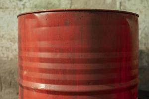 Red barrel for fuel. Oil barrel from stock. Steel tank. photo