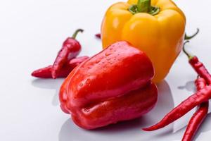 Fresh torn red sweet pepper from the autumn harvest photo