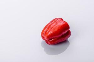 Fresh torn red sweet pepper from the autumn harvest photo