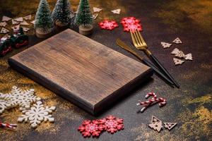 Beautiful gingerbread on a brown ceramic plate with Christmas tree decorations photo