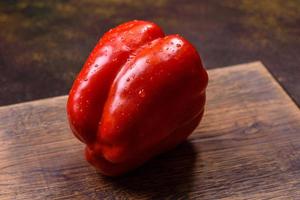 Fresh torn red sweet pepper from the autumn harvest photo