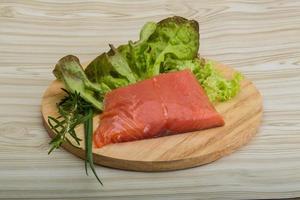 Salmon fillet on wood photo