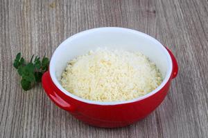 Shredded parmesan on wood photo