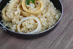 Squid risotto dish photo