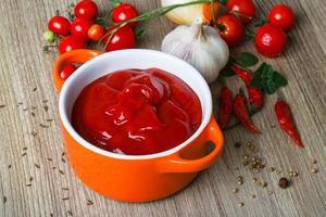 Tomato ketchup on wood photo