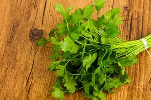 Parsley on wooden background photo