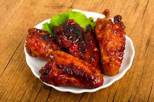 Chicken wings on wood photo