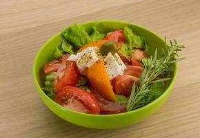 Greek salad on wood photo