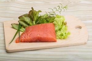 Salmon fillet on wood photo