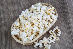 Popcorn on wood photo