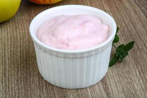 Strawberry yoghurt on wood photo