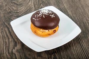 Bouchee cake on the plate and wooden background photo