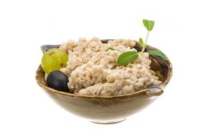 Oats porridge on white photo